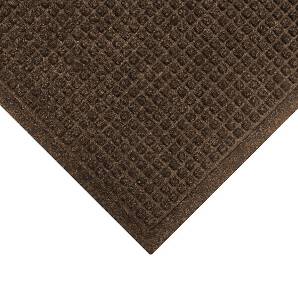 A dark brown M+A Matting WaterHog mat with a square patterned border.