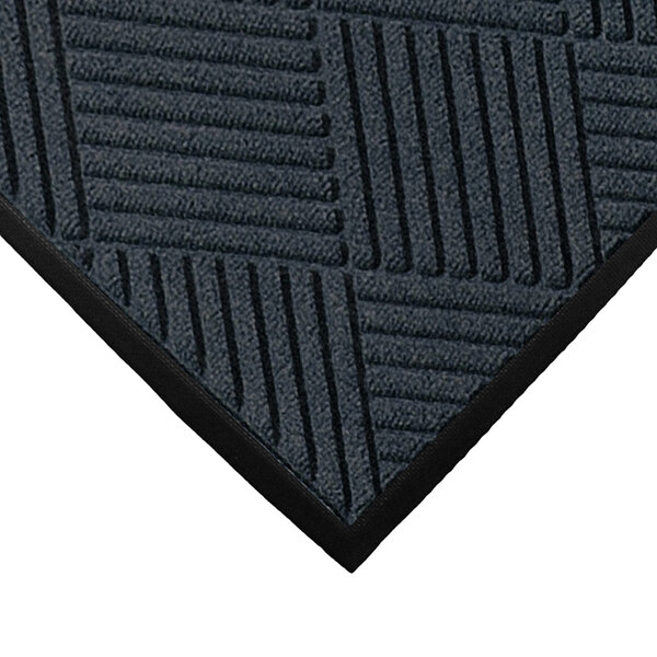 A close-up of a black M+A Matting WaterHog Classic Diamond entrance mat with a gray pattern.