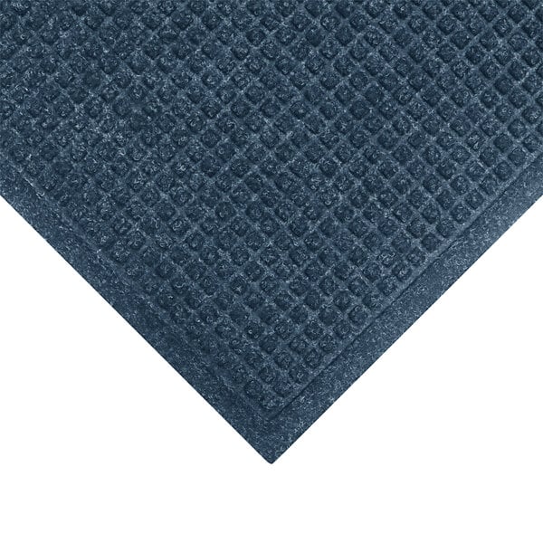 A WaterHog medium blue mat with a diamond pattern and fashion fabric border.