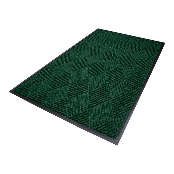 A rectangular green mat with a textured, checkered pattern and a black rubber border.