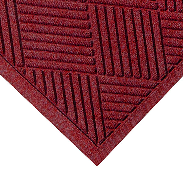 A red WaterHog mat with a square pattern and black border.