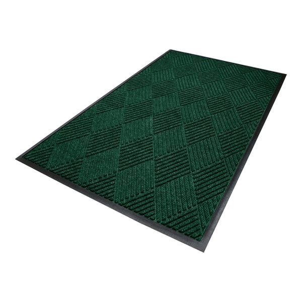 A rectangular green mat with a textured, checkered pattern and a black border.