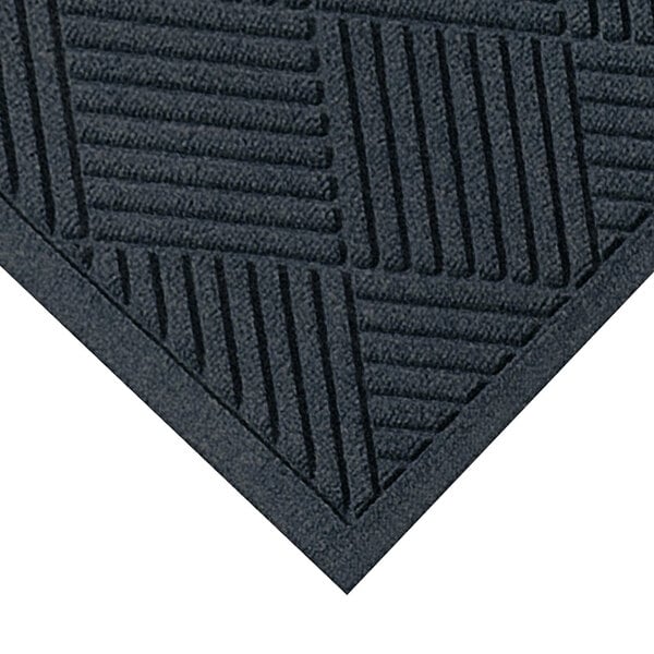 A close-up of a M+A Matting black WaterHog Diamond fashion mat with a square pattern.