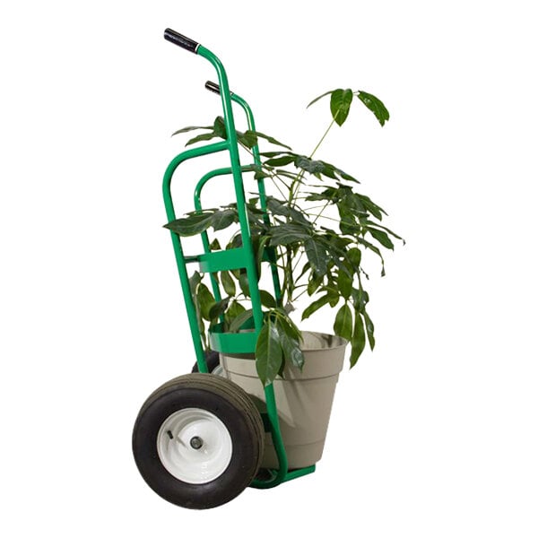 A green Valley Craft heavy duty hand truck with a plant in it.