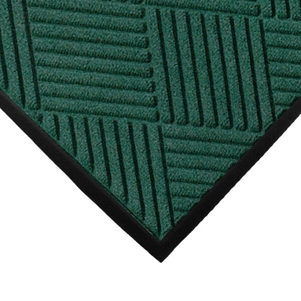 A green WaterHog mat with black stripes.