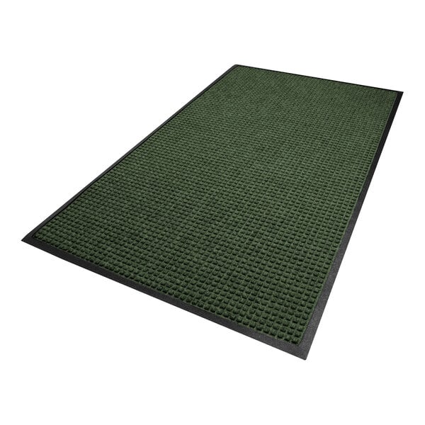 A rectangular green mat with a textured surface and a black border.