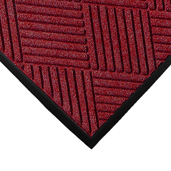 A red WaterHog mat with black stripes.