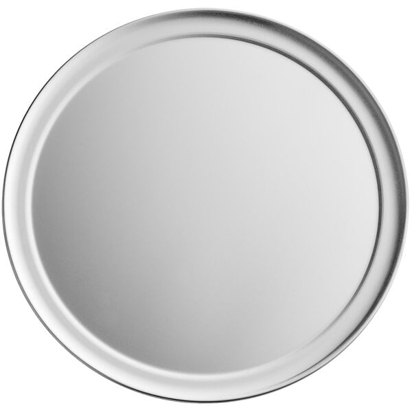 A white round plate with a silver rim.