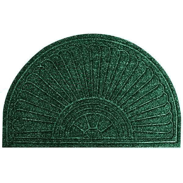 A green doormat with a fan-shaped design.