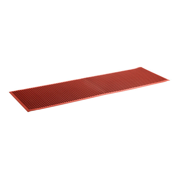 A red rubber anti-fatigue floor mat with beveled edges and small holes.
