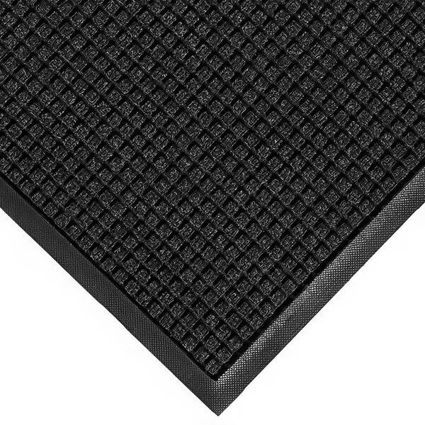 A close-up of a black WaterHog Classic mat with a rubber border.