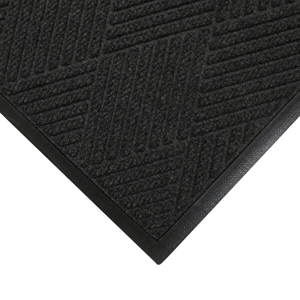 A black WaterHog mat with a rubber border and smooth backing.