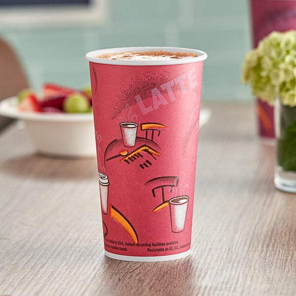 A pink Solo Bistro paper hot cup with a drawing on it full of coffee with a lid on it.