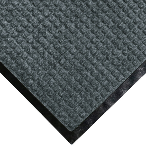 A grey M+A Matting WaterHog carpet mat with black rubber border.