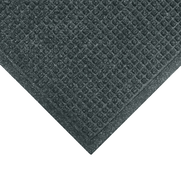 A close up of a black M+A Matting WaterHog mat with a square pattern.