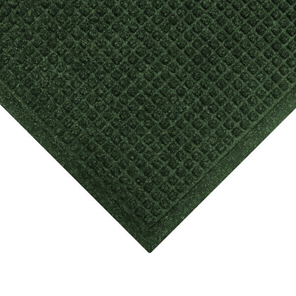 A green WaterHog carpet with a square pattern.