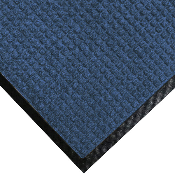 A medium blue M+A Matting WaterHog mat with black rubber border.