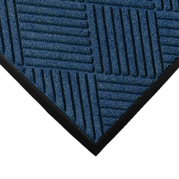 A close-up of a navy blue WaterHog mat with black diamond lines.