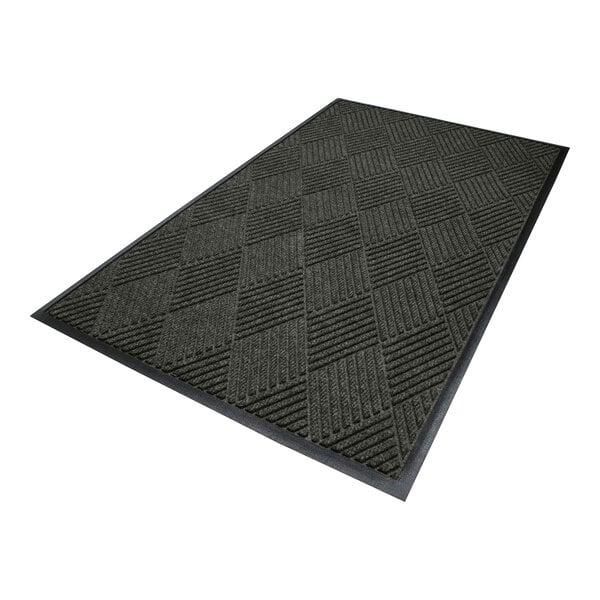 A rectangular dark-colored mat with a textured diamond pattern and a smooth black border.