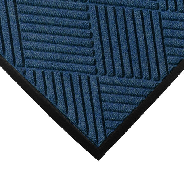 A close-up of a blue WaterHog mat with black lines on it.