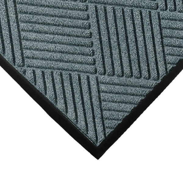 A WaterHog Classic bluestone mat with black rubber border.