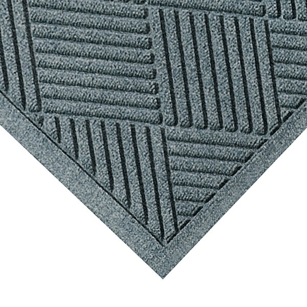 A close-up of a grey WaterHog Diamond Fashion mat with a pattern of squares.