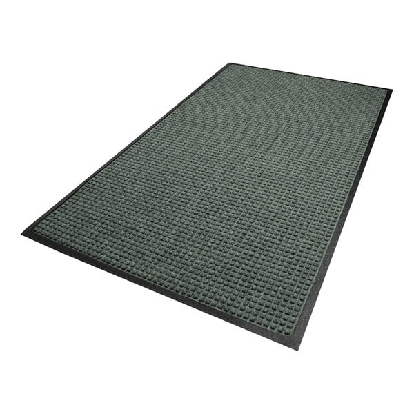 A rectangular mat with a textured, grid-like surface in a bluish-gray color and a smooth black border.