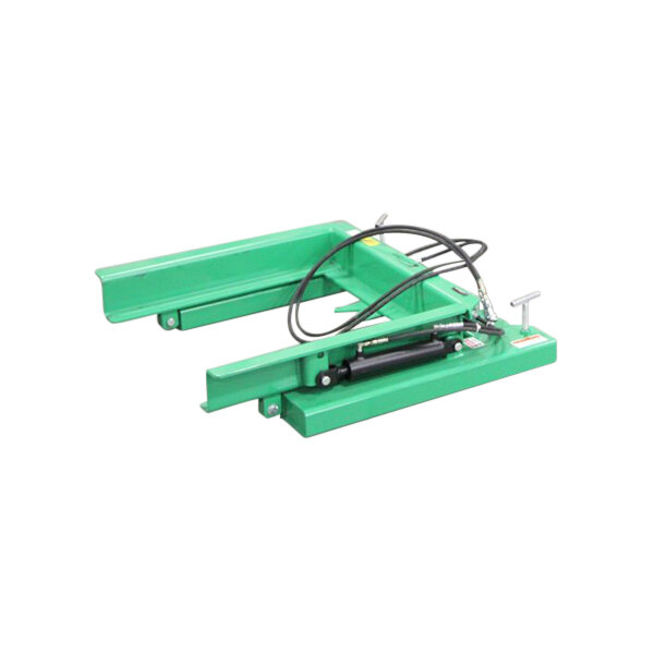 A green Valley Craft hydraulic dump fork truck attachment.