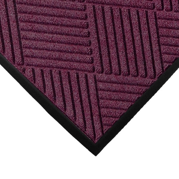 A purple WaterHog Classic entrance mat with black stripes and a rubber border.