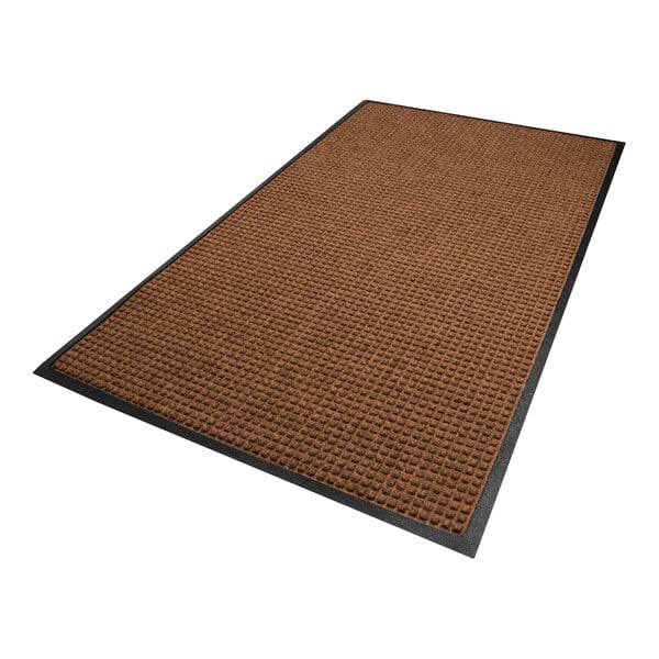 A rectangular brown mat with a textured surface and a black border.