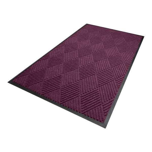 A rectangular mat with a diamond pattern in a bordeaux color, bordered by a black edge.