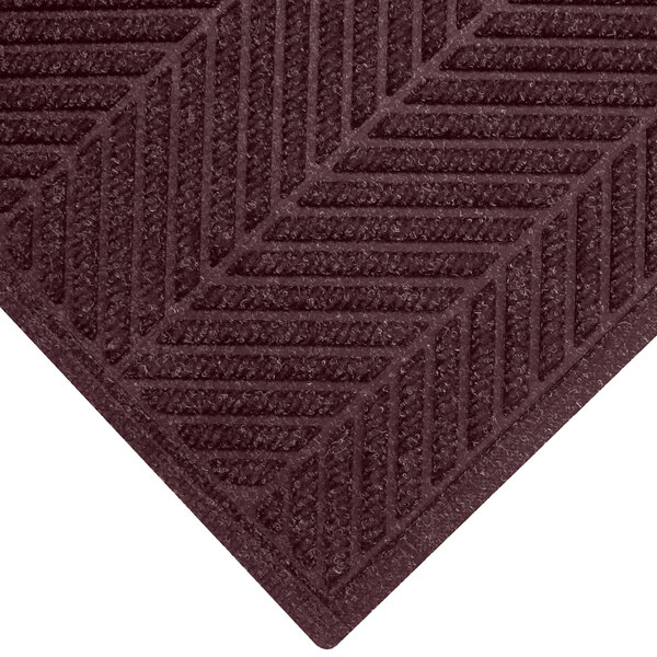 A maroon M+A Matting WaterHog Eco Elite mat with a chevron border.