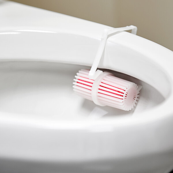 A Lavex toilet rim cage in a toilet bowl.