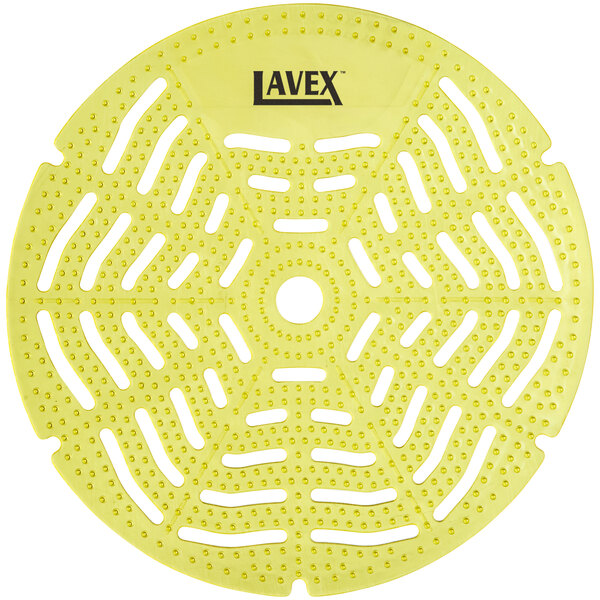 A yellow circular Lavex urinal screen with holes in it.