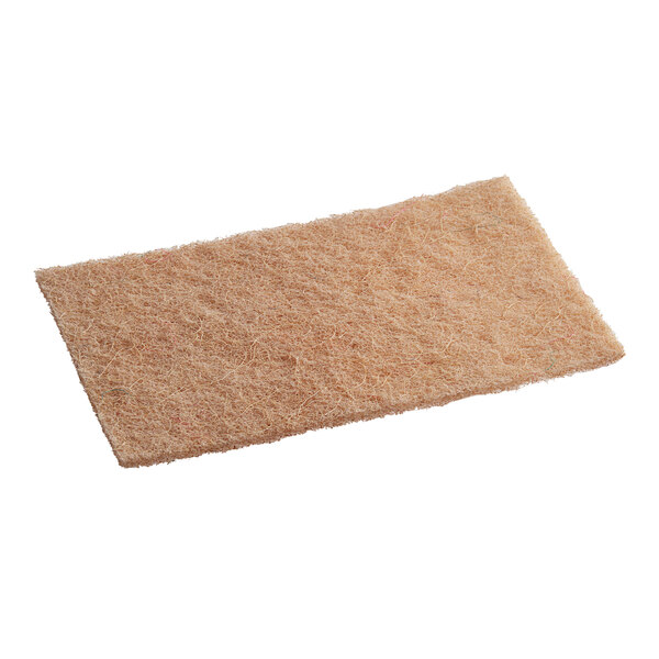 A close-up of a Lavex Eco heavy-duty sisal scouring pad.