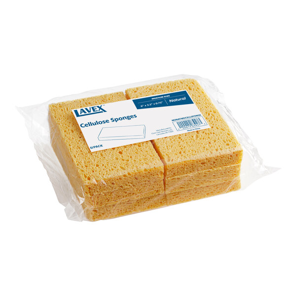 A package of six Lavex natural cellulose cleaning sponges.