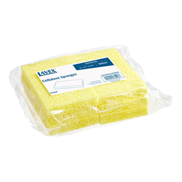 A plastic bag holding a pack of 6 yellow Lavex cellulose sponges.