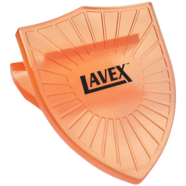 An orange Lavex toilet bowl clip with black text on it.