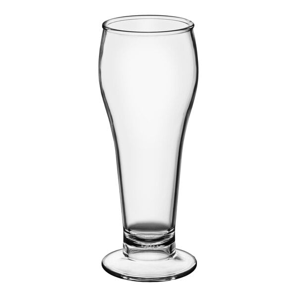 A clear, footed pilsner glass made of SAN plastic with a 22 oz. capacity.