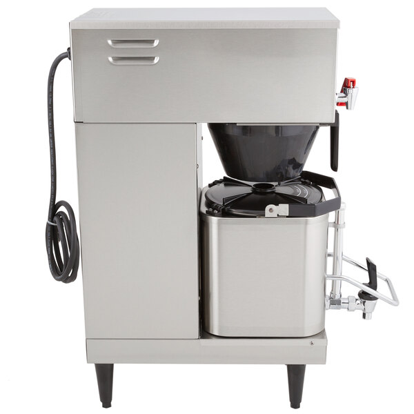 A Grindmaster commercial coffee maker with a coffee filter.