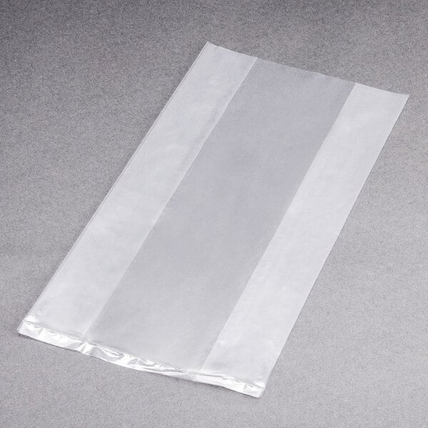 A clear LK Packaging plastic food bag on a grey surface.