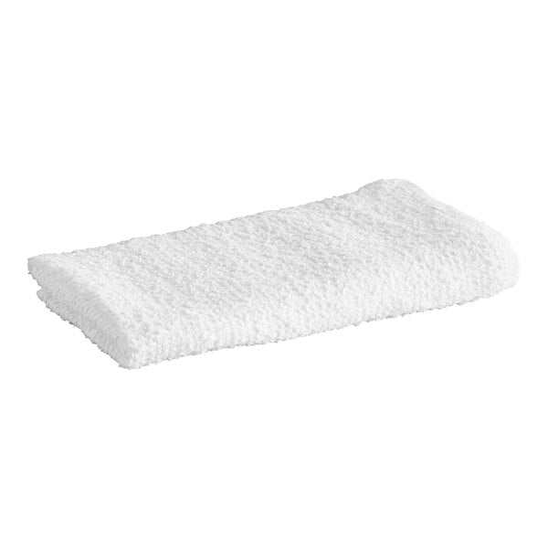 A folded white textured towel is shown against a plain background.