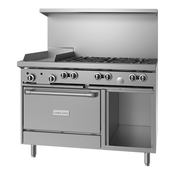 A large stainless steel Garland range with 6 burners, a griddle, and storage.