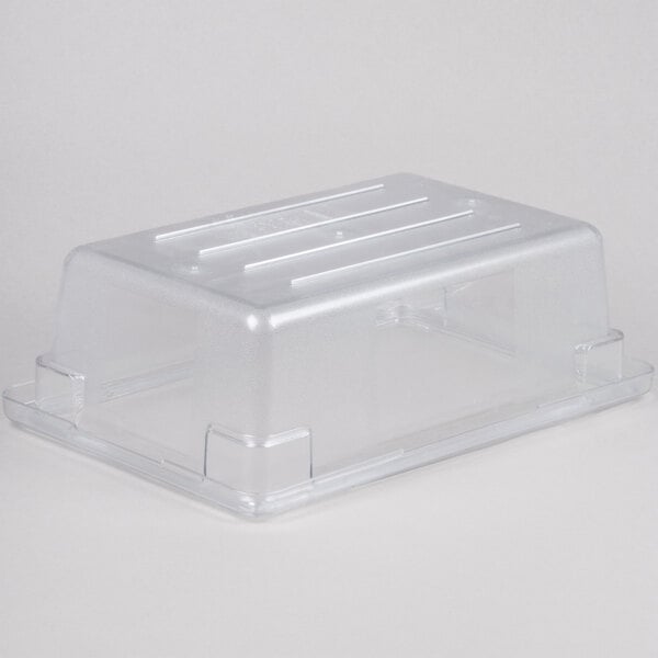 A clear Rubbermaid polycarbonate food storage container with a lid.