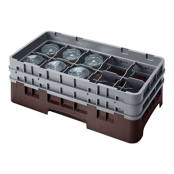 A brown and gray Cambro glass rack with 10 compartments and two extenders, holding several glasses.