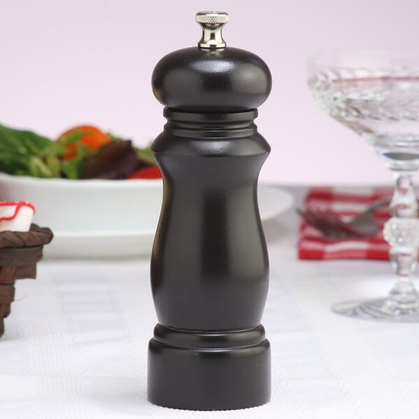 A Chef Specialties Salem ebony finish pepper mill on a table.
