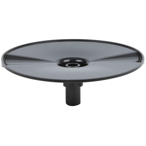 A black circular discharge plate with a metal handle.