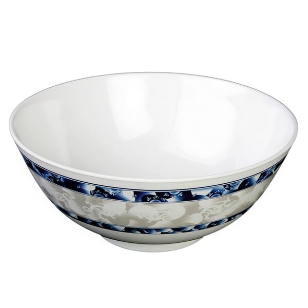 A white melamine bowl with blue dragon designs.