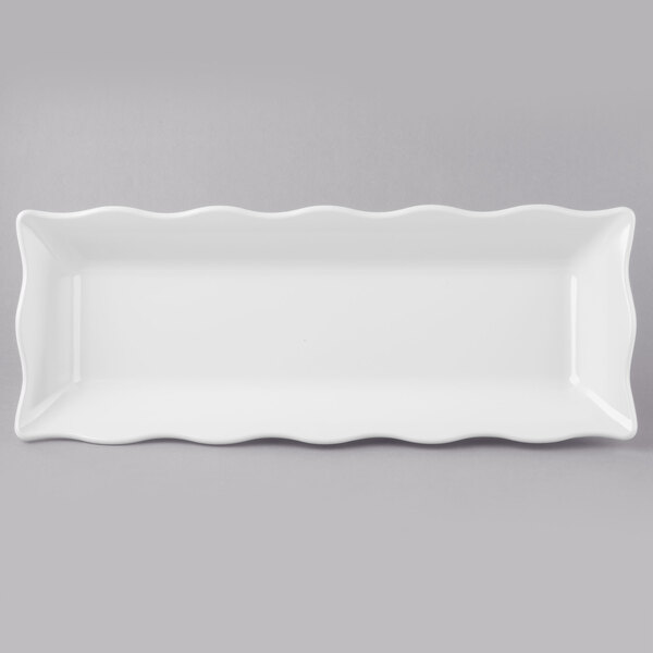 A white rectangular melamine tray with scalloped edges.