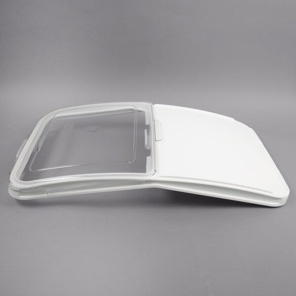 A clear plastic lid with a white plastic sliding cover.